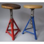 A Pair of Circular Topped Rise and Fall Stools on Metal Tripod supports, 26cm Diameter