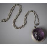 A Chinese Export Amethyst and White Metal Mounted Pendant Carved with Flower