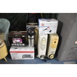 A Collection of Various Electrical Items to Include Three Heaters, Steam Cleaner, Sandwich