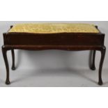 An Edwardian Mahogany Duet Piano Stool with Upholstered Hinged Lid and on Cabriole Supports, 96cm