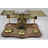 A Set of Early 20th Century Brass Postage Scales on Serpentine Front Wooden Plinth, Some Weights but