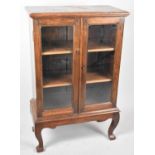 A Glazed Side Cabinet on Short Cabriole Supports, 64cm Wide