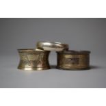A Collection of Three Hallmarked Silver Napkin Rings