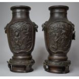 A Pair of Late 19th Century Japanese Bronze Vases Decorated in Relief and Having Two Ring Carrying