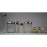 A Collection of Three Small Silver Glass Bottles and Five Dressing Table Pots with Monogrammed