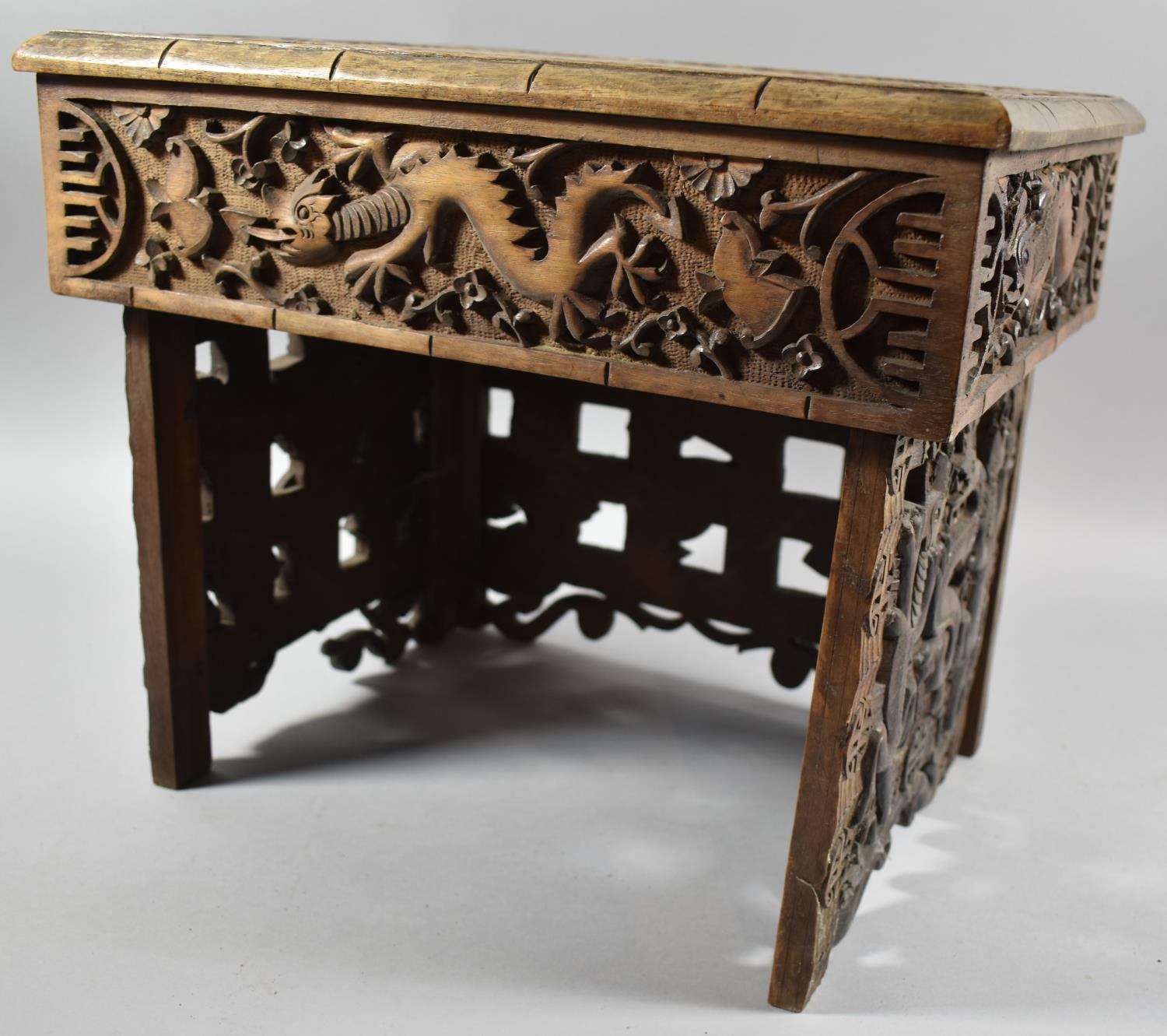 An Interesting Heavily Carved Oriental Folding Box Seat Decorated with Dragons, One Panel Missing - Image 5 of 7