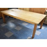 A Rectangular Pine Kitchen Table on Square Supports, 158cm x 54cm