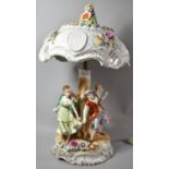 A Modern German Figural Porcelain Table Lamp in the Form of Couples Dancing Around Tree Stump,