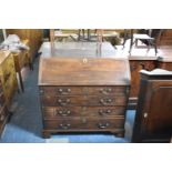 A George III Mahogany Bureau with Crossbanded Fall Front to Fitted Interior, Four Graduated