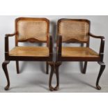 A Pair of Cane Seated and Backed Mahogany Armchairs, both Seats Requiring Attention