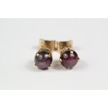 A Pair of 14ct Yellow Gold Star Sapphire Ear Studs