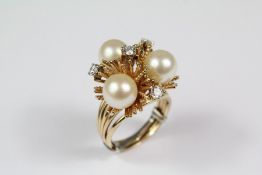 ..A Lady's 14ct Yellow Gold Stylistic Diamond and Pearl Ring