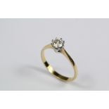 An 18ct Gold and Solitaire Diamond Ring