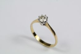 An 18ct Gold and Solitaire Diamond Ring