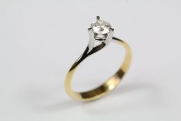 An 18ct Yellow and White Gold Solitaire Diamond Ring