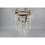 An Elegant Circular Gilt Brass Cut-Crystal Chandelier