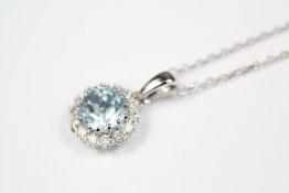 An 18ct White Gold Aquamarine and Diamond Pendant