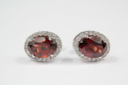 A Pair of 18ct White Gold and Garnet Earrings