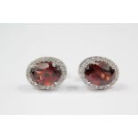 A Pair of 18ct White Gold and Garnet Earrings