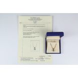 A Platinum and 18ct Yellow Gold Diamond Solitaire Pendant