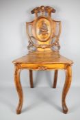 An Antique Walnut Heraldic Hall Chair