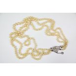 A Triple Strand Cultured Pearl Necklace