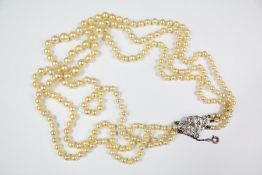 A Triple Strand Cultured Pearl Necklace