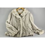 A Lady's Light Grey Faux Fur Jacket