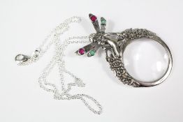 A Silver Magnifying Glass of Pendant Form