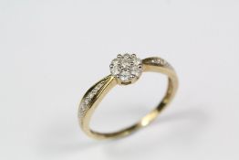 A Yellow Gold Daisy Head Style Diamond Ring