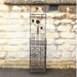 A Wrought Metal Wine Rack Stand