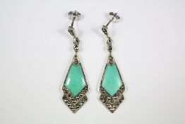 A Pair of Silver and Turquoise Earrings