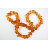 An Amber-Coloured Glass Necklace