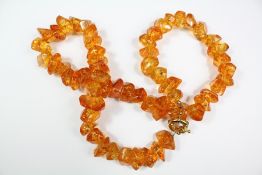 An Amber-Coloured Glass Necklace