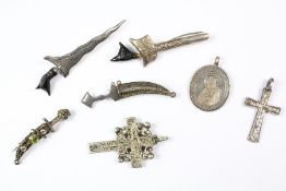 Quantity of Malay Kris & curved Arabic dagger brooches with Coptic Cross Pendant.