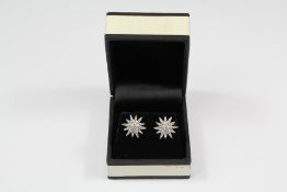 A Pair of Silver and CZ Earrings