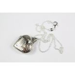 A Silver Heart-Shaped Photo Locket