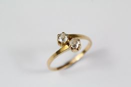 A Yellow Gold Diamond Cross Over Ring