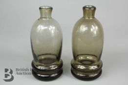 Two Brown Glass Bottle Vases