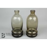 Two Brown Glass Bottle Vases