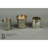 Three White Metal Beakers