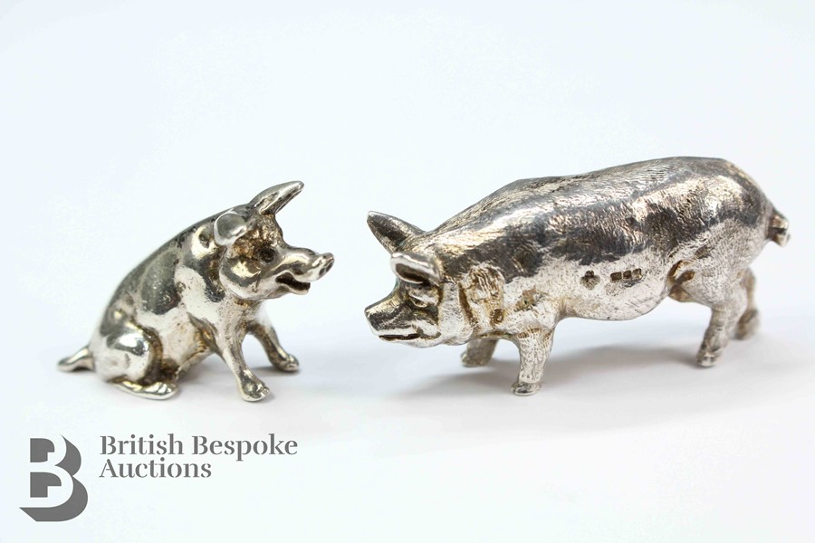 Two Silver Pigs