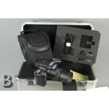 A Sony CyberShot DSC-R1 Camera and Sony Hard Camera Case