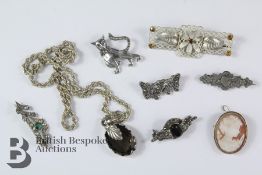 Seven Silver Brooches and One Necklace