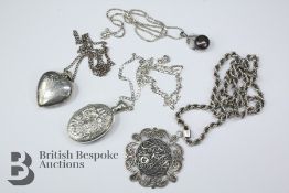 Four silver pendants