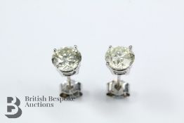 A Pair of 14/15 ct White Gold Diamond Stud Earrings