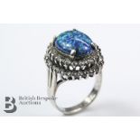 A White Metal and Synthetic Black Opal Ring