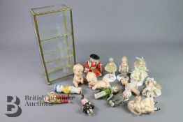 Fourteen Miniature Dollies