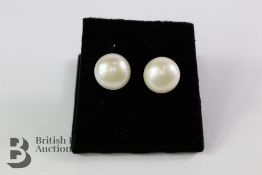 A Pair of Pearl Stud Earrings.