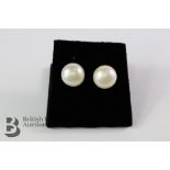 A Pair of Pearl Stud Earrings.